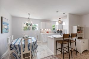 a kitchen and dining room with a table and chairs at 1018 East Cooper in Folly Beach