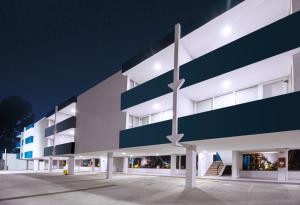 an exterior view of a building at night at Vista Express Guadalajara Expo in Guadalajara