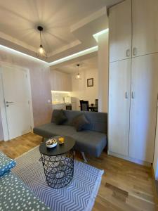 a living room with a couch and a table at Studio Snežana in Zlatibor