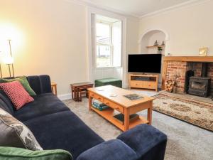 a living room with a couch and a coffee table at Ings House in Hawes