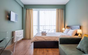 Postel nebo postele na pokoji v ubytování Studio Apartment NFT New Gudauri 503