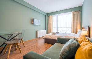 Postel nebo postele na pokoji v ubytování Studio Apartment NFT New Gudauri 503 + 37 fotografií