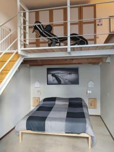 a bedroom with a bed in a loft at Atelier Relax Petit Turin - Centralissimo in Turin