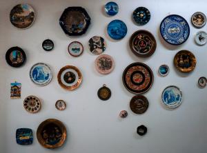 a bunch of plates hanging on a wall at Hostal Cuija Coyoacan Berlin 268 Coyoacan in Mexico City