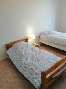 Giường trong phòng chung tại Les Terrasses de Marcq +2 ảnh