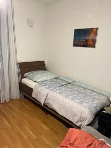 a small bedroom with a bed and a window at Beautiful apartment for you in Ulm