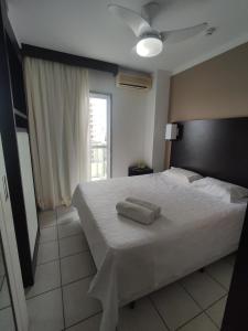 Ένα ή περισσότερα κρεβάτια σε δωμάτιο στο Flat 805 Triângulo Apart