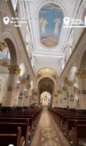 a view of a church with pews in it at perla del norte in Bello