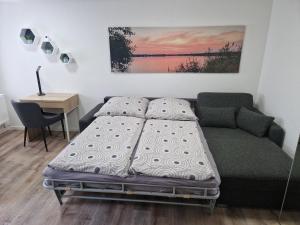 Postel nebo postele na pokoji v ubytování Ferienhaus Gisela Arendsee