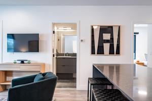 a living room with a table and a couch at Escape to Revy - Beautifully Designed Condo in Revelstoke