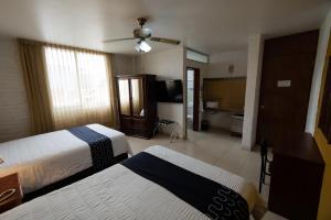 Voodi või voodid majutusasutuse Hotel HC toas