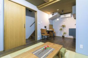 an open living room with a table and a dining room at Nadeshiko Machiya - Vacation STAY 27197v in Fukuoka