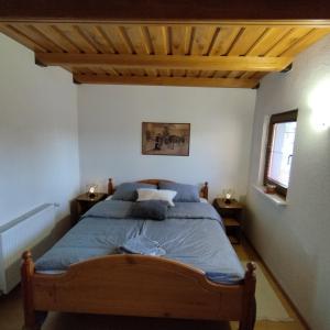 Кровать или кровати в номере Holiday home Novak M