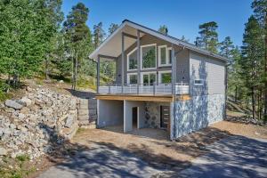 a house on a hill with a stone wall at Holy Moly by Hilla Villas in Pelkosenniemi