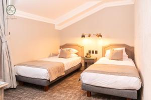 Rúm í herbergi á Hotel José Nogueira