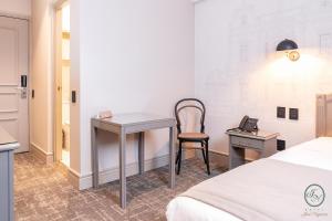 Rúm í herbergi á Hotel José Nogueira