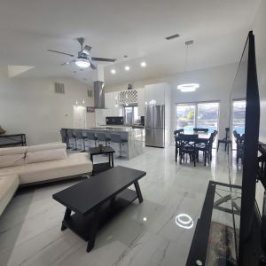 a living room with a couch and a table at Sunsets by the Water in Cape Coral