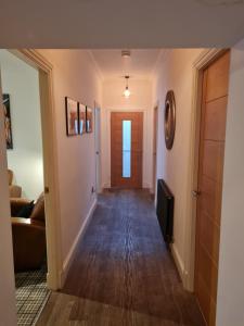 a hallway with a door leading to a living room at Cullen Holiday Home in Cullen