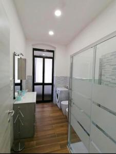 a bathroom with a toilet and a sink and a shower at Calipso casa vacanza in La Spezia