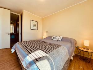 Postel nebo postele na pokoji v ubytování Acogedor departamento en Puerto Varas Chile