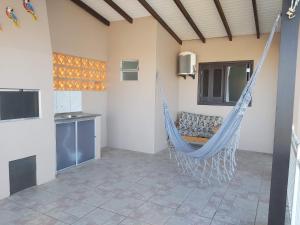 Μια τηλεόραση ή/και κέντρο ψυχαγωγίας στο Apto com terraço coberto