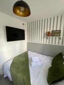 Postelja oz. postelje v sobi nastanitve One bedroom Putney Village flat