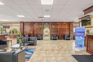 a lobby with chairs and a waiting room at Quality Inn & Suites Near Fairgrounds & Ybor City in Tampa