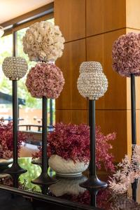 a group of flowers on display on a table at Radisson Blu Martinez Beirut in Beirut