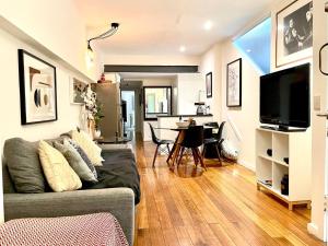 a living room with a couch and a table at Seddon Studios in Melbourne