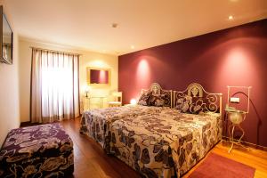 Uma cama ou camas num quarto em Casa Dos Poos
