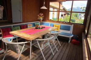 a dining room with a table and chairs at Küferhof in Mellau