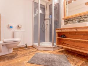 a bathroom with a shower and a toilet at Pension Blaiken XL in Scheffau am Wilden Kaiser