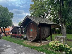 a large wooden barrel house in a park at Villa Haag in Haag