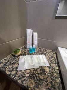 a counter in a bathroom with a sink and a towel at Sentral View Hotel Bintulu in Bintulu