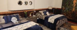 Postel nebo postele na pokoji v ubytování Tres Fuentes Hotel Boutique