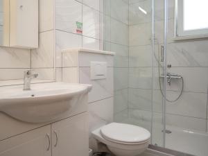 a bathroom with a toilet and a sink and a shower at Family friendly house with a swimming pool Vinovac, Zagora - 22041 in Blizna Donja +17 photos