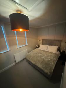 Krevet ili kreveti u jedinici u okviru objekta Luxurious New Serviced Apartment (Surrey)