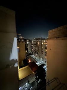 a view of a city at night with buildings at Flat Copacabana Posto 4 in Rio de Janeiro