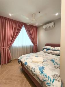Ένα ή περισσότερα κρεβάτια σε δωμάτιο στο Afida Homestay Metrocity Kuching