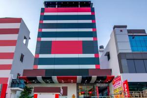 a tall building with colorful stripes on it at Hotel Spar Grand in Visakhapatnam