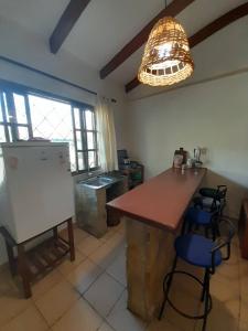 a kitchen with a table and chairs in a room at Fonda Amboró in Samaipata