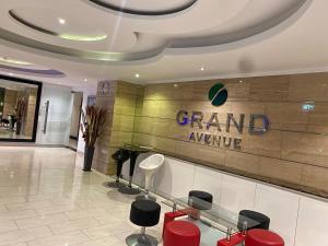 a grand avenue sign on a wall in a lobby at Large Ground Floor Condo, Grand Avenue, Central Pattaya in Pattaya Central +18 photos