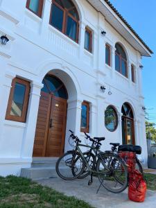 two bikes parked in front of a building at B2 Hotel Savannakhet in Savannakhet