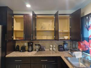 a kitchen with wooden cabinets and a counter top at Da Bottom in Curtis