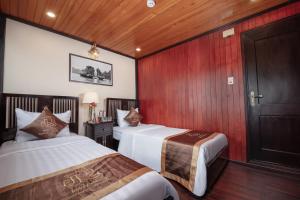 Ein Bett oder Betten in einem Zimmer der Unterkunft Ruby Cruise