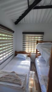 Postel nebo postele na pokoji v ubytování CASA CAMPESTRE LAS MARIAS