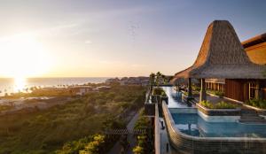 an aerial view of a resort with a swimming pool at Holiday Inn Resort Bali Canggu by IHG in Canggu