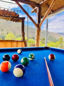 a pool table with balls on top of it at Quinta Estefanía, Paute-Uzhupud in Cuenca