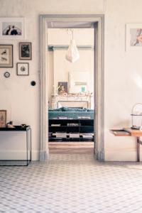 a door leading to a bedroom with a bed at La Nuit & Le Jour in Vertheuil-en-Médoc +22 photos