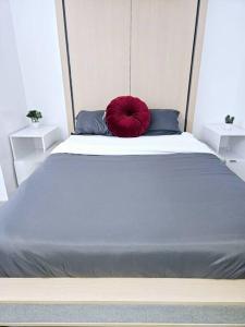 En eller flere senge i et værelse på Tremont Smart 9 - A KCM Property